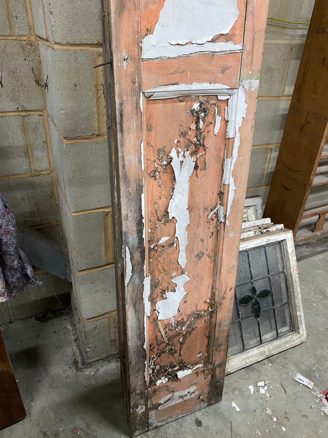 A pair of painted and stained glass inset doors, width 35cm height 209cm and a set of eight painted leaded glass windows, 46 x 51cm